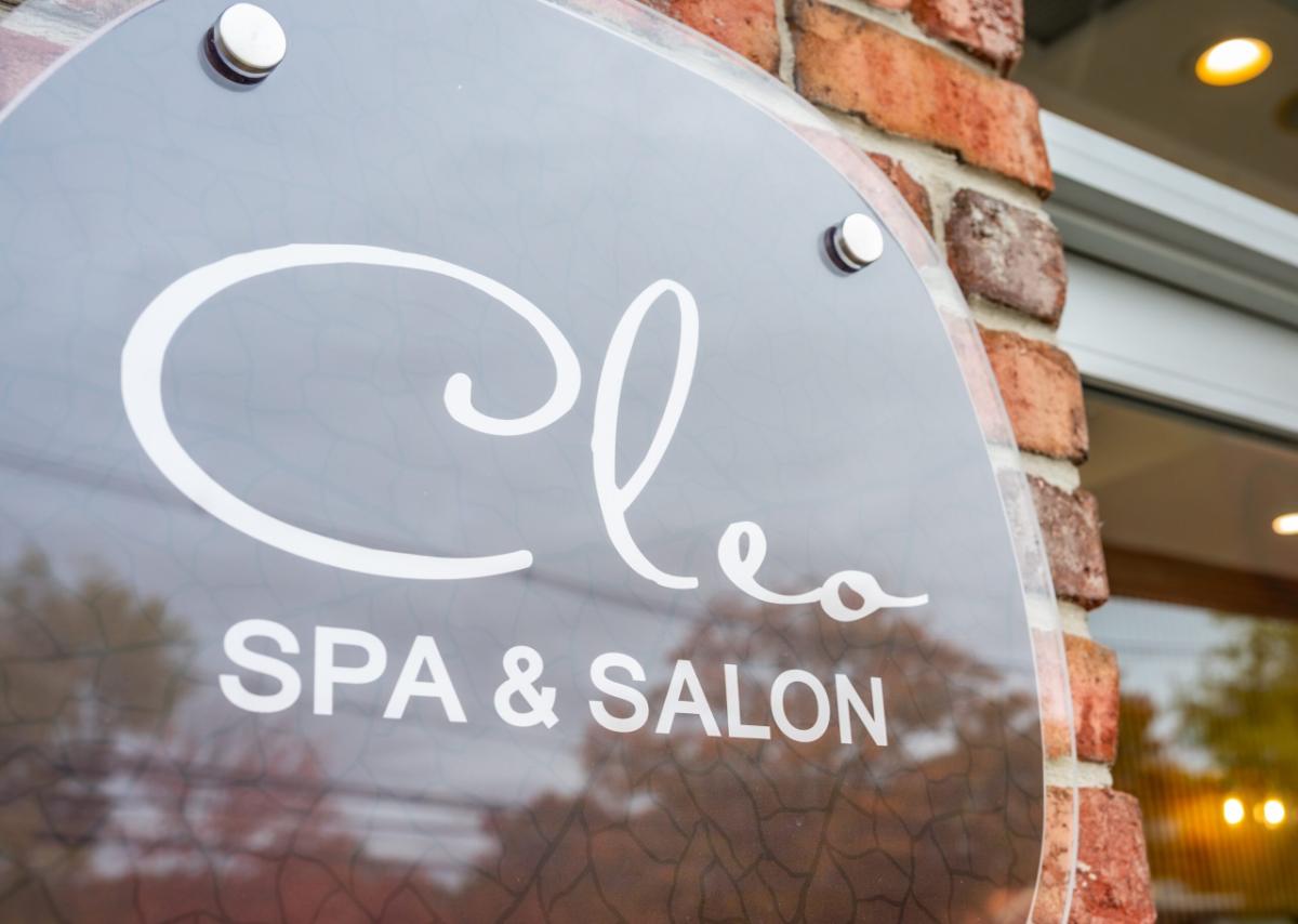 Cleo Spa & Salon sign on the brick storefront